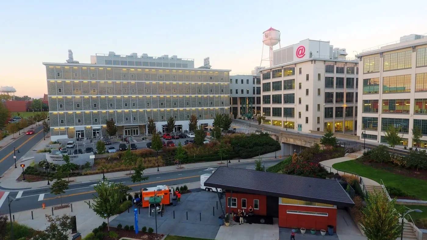 Innovation Quarter in Winston-Salem featuring modern research and office buildings, green spaces, and walkways within a vibrant urban innovation district.