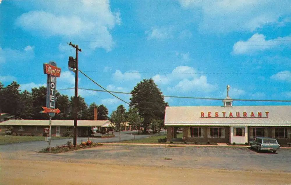 Our history — vintage roadside scene with a neon "Royale MOTEL" arrow, U-shaped single-story motel units, a "RESTAURANT" storefront, a classic car, and trees under a blue sky.